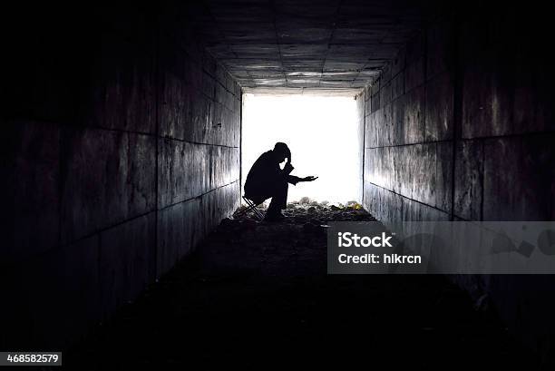 Sad Man Sitting In The Tunnel Stock Photo - Download Image Now - Begging - Social Issue, Assistance, Poverty