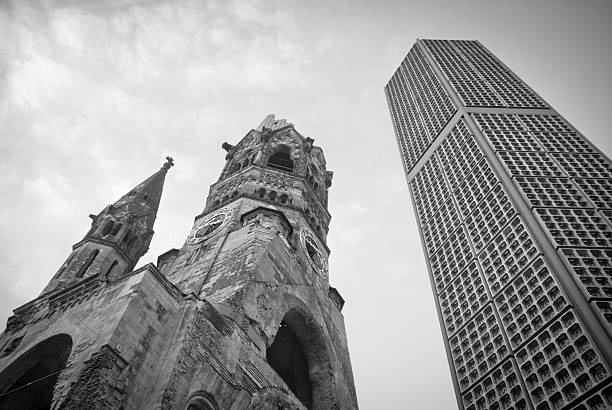 Breitscheidplatz, Berlin. Towers black and white Breitscheidplatz, Berlin. The old church and modern tower from the ground in black and white kaiser wilhelm memorial church stock pictures, royalty-free photos & images