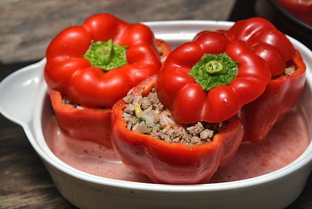 istock Stuffed red sweet peppers with meat and rice 468584144