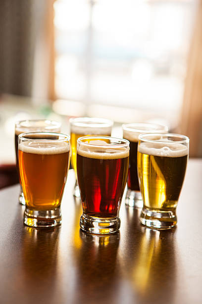 istock Six samples of beer on a table in the pub. 468584308