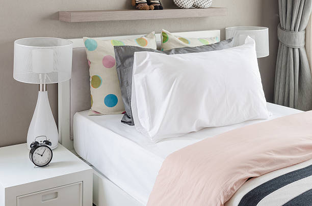 istock kid's bedroom with white pillows and lamp on modern bed 468584320
