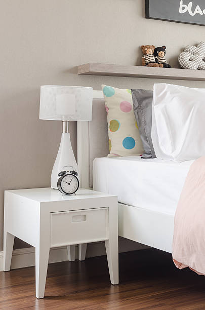 istock kid's bedroom with white pillows and lamp on modern bed 468584322