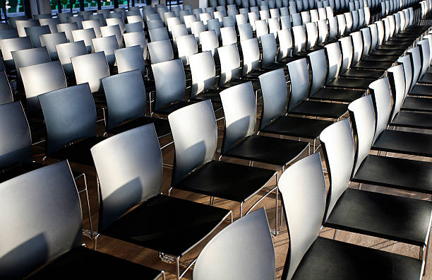 istock Rows of empty chairs prepared for an indoor event 468585344