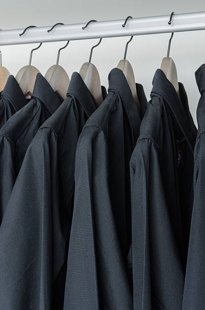 istock row of black shirts hanging on coat hanger 468585606