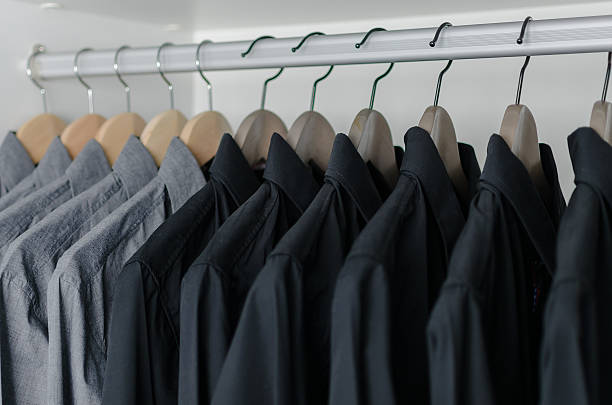 istock row of black shirts hanging on coat hanger 468585612