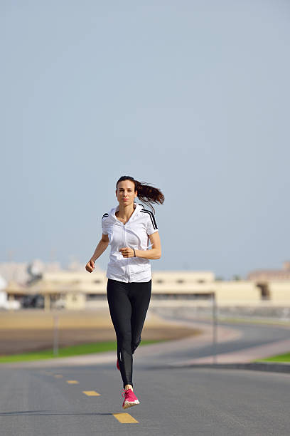 istock woman jogging at morning 468587867