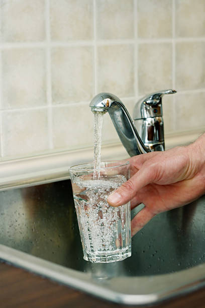 istock Filling up a glass of water 468588071
