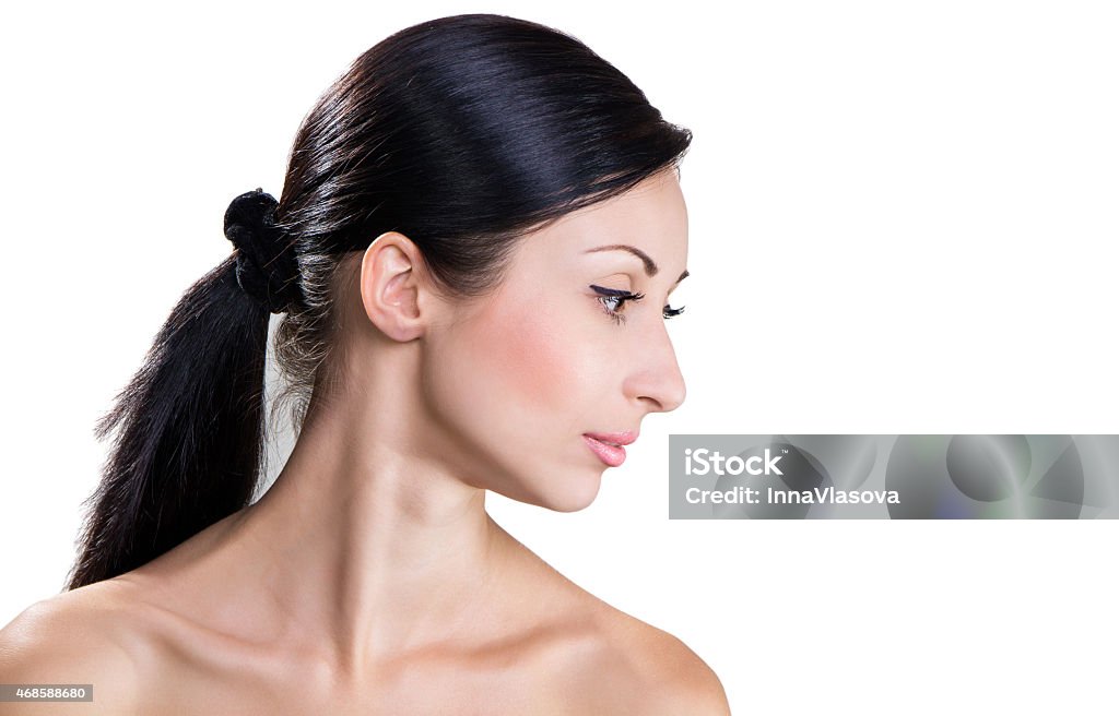 beautiful woman's portrait  on white background Portrait of a beautiful brunette in profile 20-24 Years Stock Photo