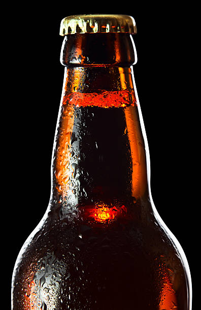 istock frozen beer bottle isolated on black , saved clipping path 468591119