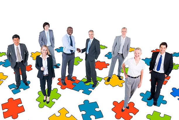 istock Group of Business People with Jigsaw Puzzle 468593306