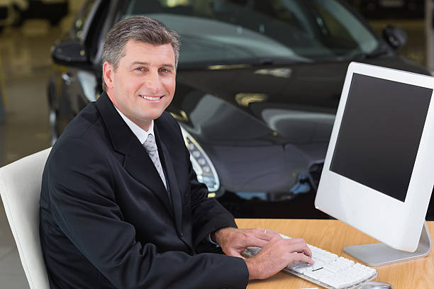 istock Smiling businessman typing on laptop 468593416