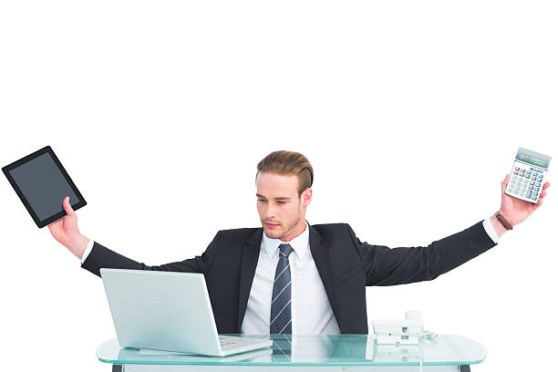 istock Businessman with arms up holding tablet and calculator 468595162