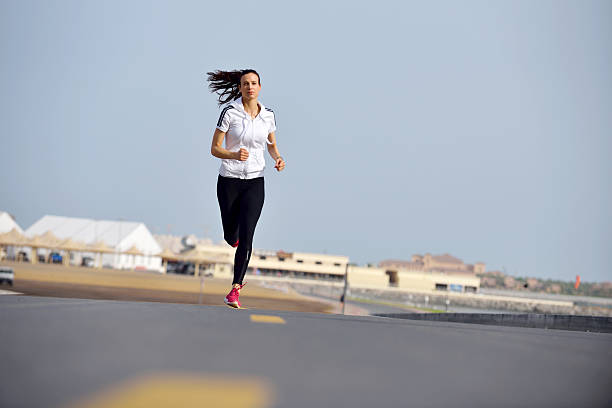 istock woman jogging at morning 468597301