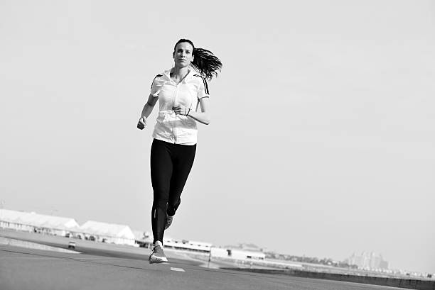 istock woman jogging at morning 468597349