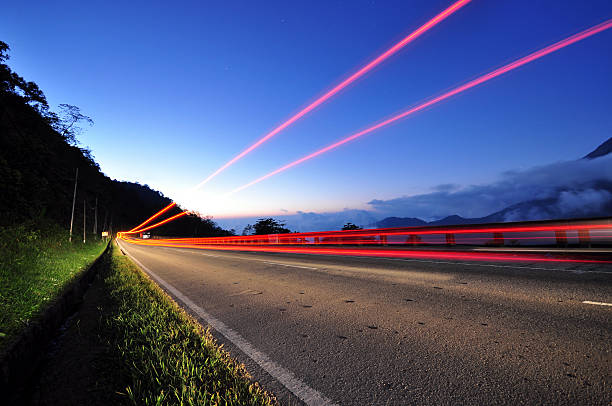 istock Long exposure of tail light on a highway during twilight 468597790