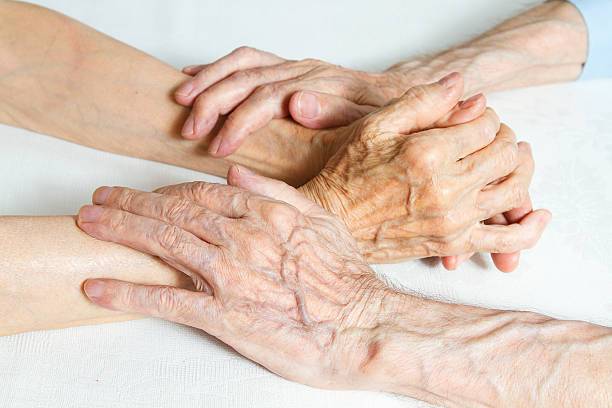 istock Old people holding hands. Closeup. 468599979