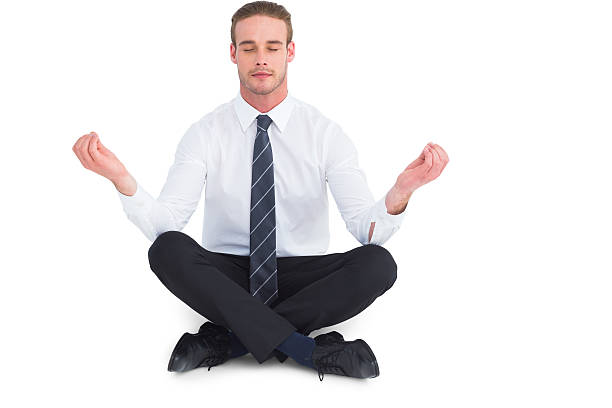 istock Businessman meditating in lotus pose 468600962