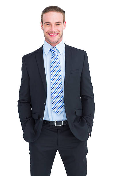 istock Smiling elegant businessman with hands in pockets 468601582