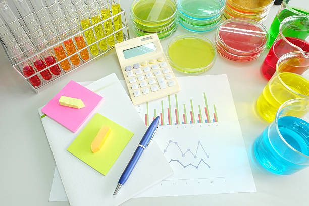 istock calculator and chart with colorful fluid in glassware 468601812