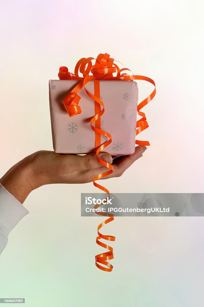 Woman hand holding a gift 2015 Stock Photo