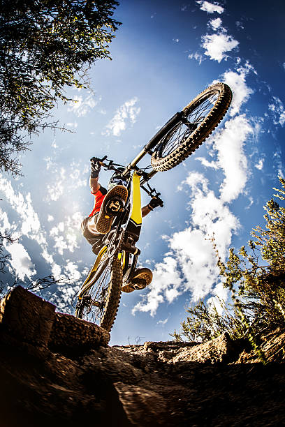 istock Extreme mountain biker dirt jumping on a trail ride 468602330