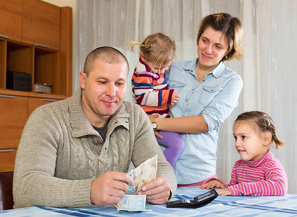 istock Happy family with banknotes 468602914