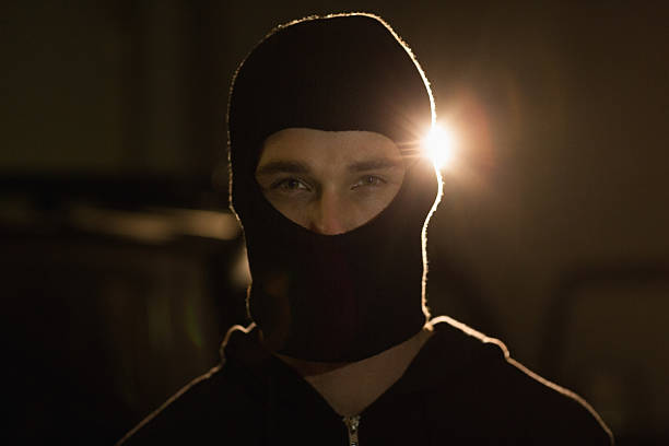 istock Criminal in balaclava looking at camera 468605360