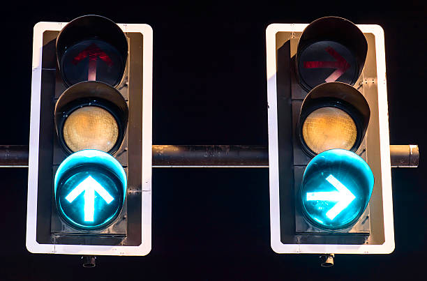 istock Green traffic lights on night background 468605630