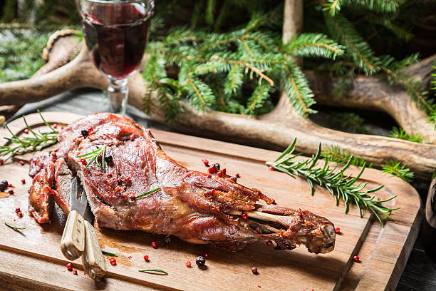 istock Cutting freshly baked venison 468605997