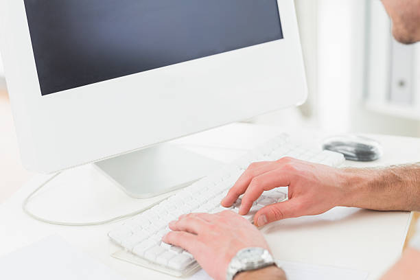 istock Businessman with watch typing on keyboard 468607234