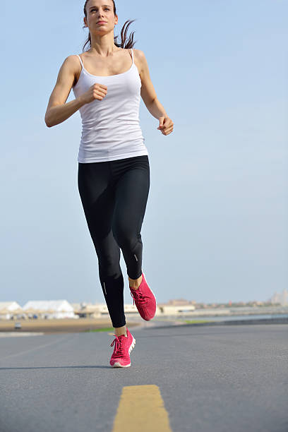 istock woman jogging at morning 468609793