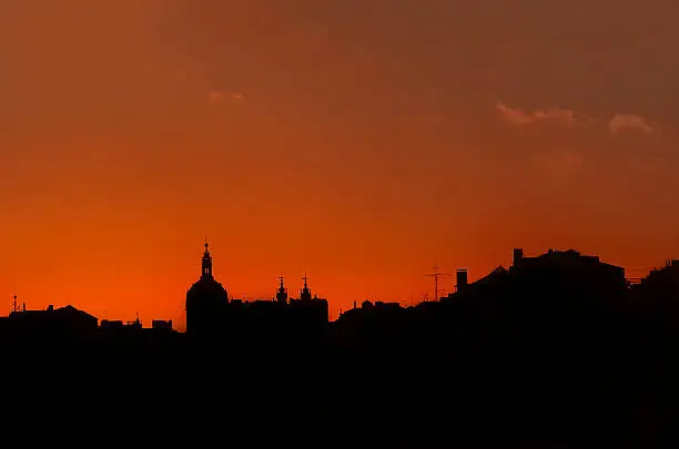 Silhouette of buildings during sunset in Lisbon