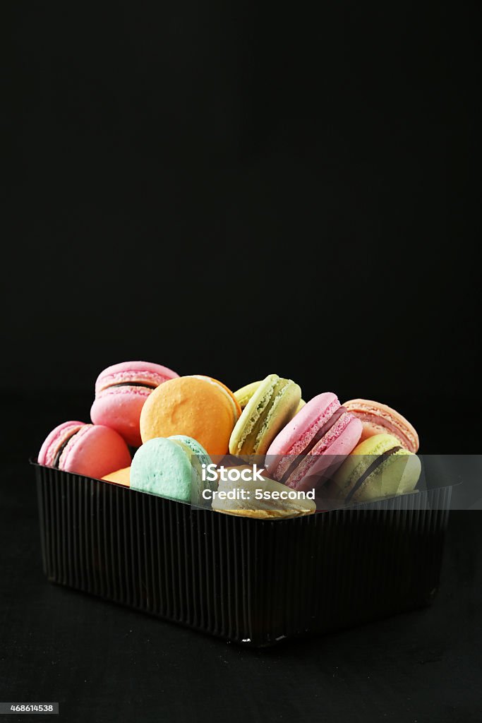 French colorful macarons on black background 2015 Stock Photo