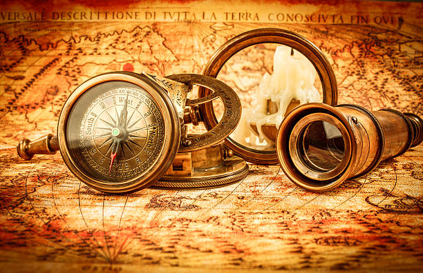 istock Vintage magnifying glass lies on an ancient world map 468614610