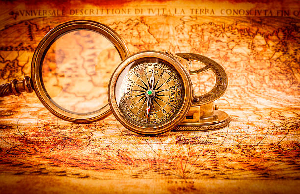 istock Vintage magnifying glass lies on an ancient world map 468614612