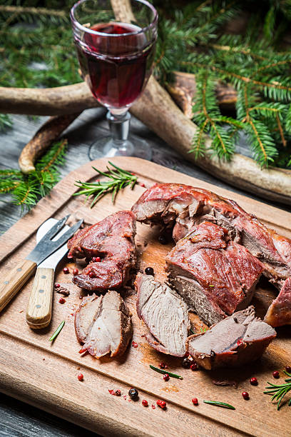 istock Sharing freshly roasted venison on a chopping board 468615043