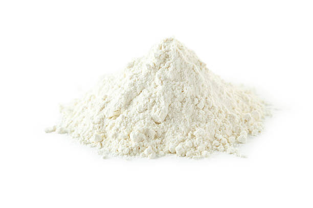 istock Heap of wheat flour isolated on white 468615202