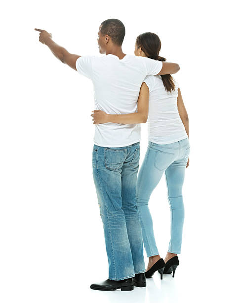istock Rear view of couple looking away and pointing 468616088