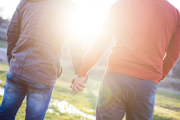 istock Two gay man holding hands 468619156