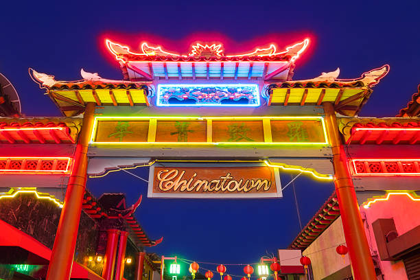 Los Angeles Colorful Traditional Chinese Gate and Sign in Chinatown Photo of an Illuminated Traditional Chinese Gate and Sign, in Chinatown, Downtown Los Angeles, California, USA at Night. chinatown photos stock pictures, royalty-free photos & images