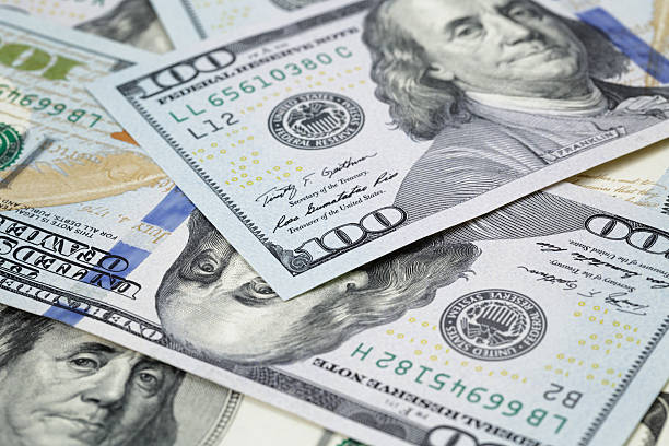 istock new hundred dollar notes on heap of old notes 468621378