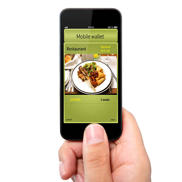 istock Man holding phone with a mobile wallet on screen 468621489