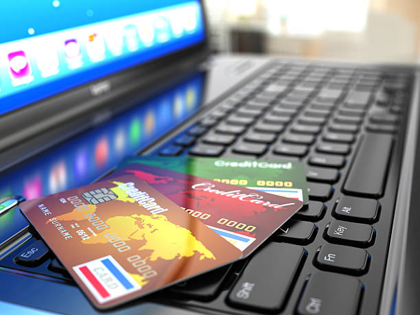 istock Online purchase. Credit card on laptop keyboard. 468622317