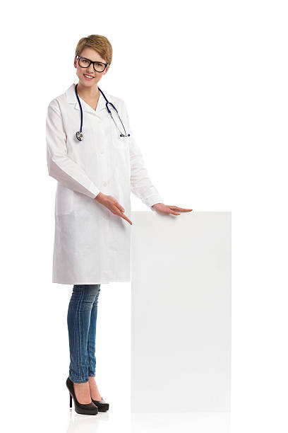 istock Doctor pointing at banner. 468622427