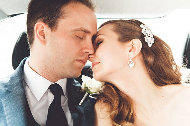 istock Bride and groom in a car 468624266