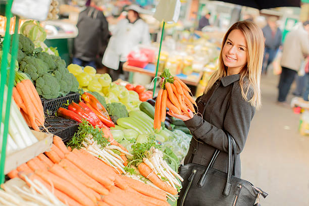 istock Young woman at the market 468624735