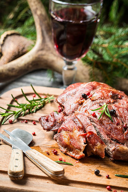 istock Cutting a piece of freshly baked venison 468625305