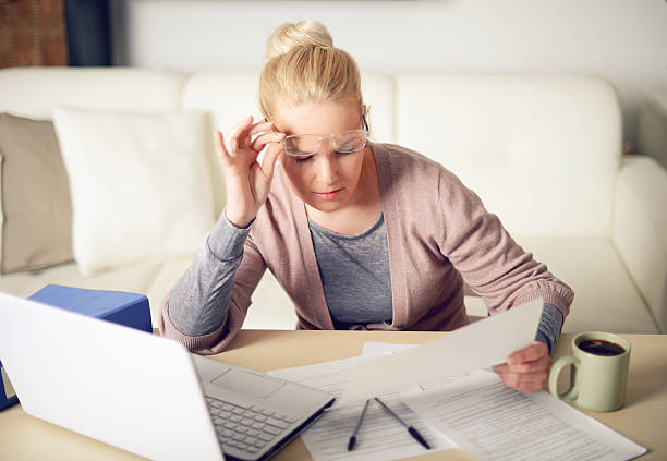 istock blonde woman working at home 468627908
