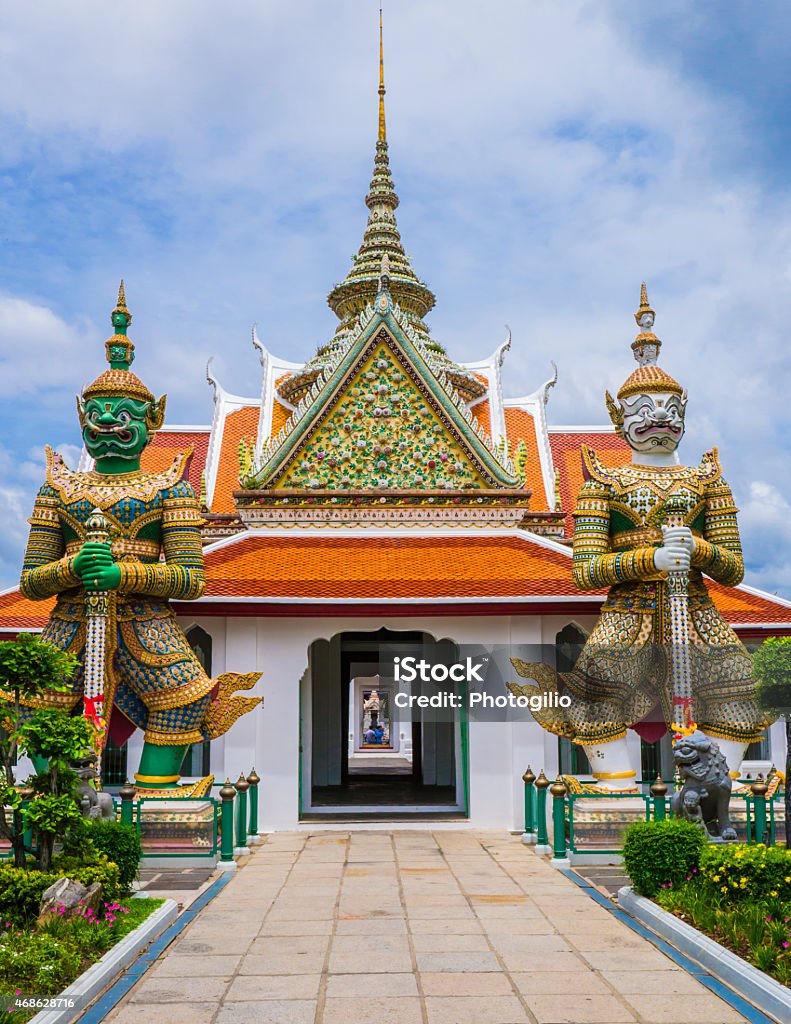 Demon guardians at Wat Arun gate, Bangkok, Thailand Entrance doorway to ordination hall with Yaksha guardians in the Wat Arun Temple, Bangkok, Thailand" 2015 Stock Photo