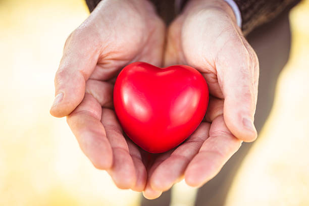 istock holding a red heart for st. valentine 468628765